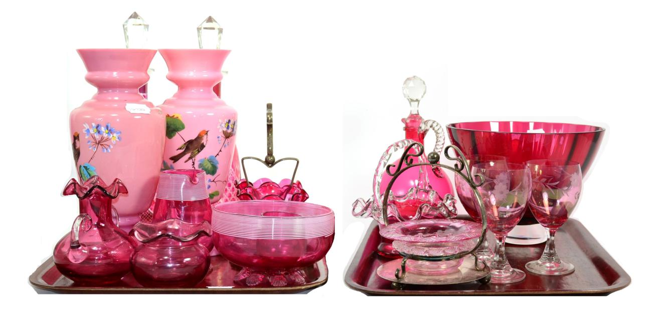 Lot 45 - A quantity of cranberry glass including three decanters with stoppers, a basket, jug, vases,...