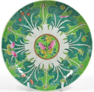 Lot 59 - A Chinese saucer dish, decorated in enamels with butterflies and green foliate border, four...