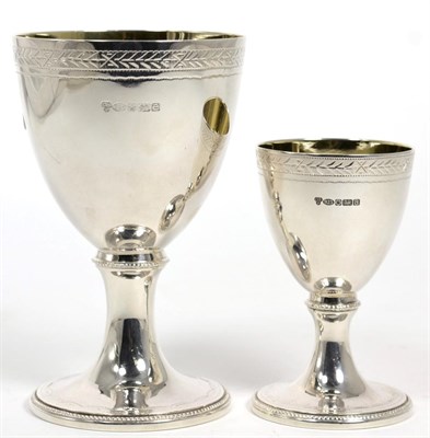 Lot 61 - A modern silver goblet of George III style, CJ Vander, Sheffield 2004; together with a smaller...
