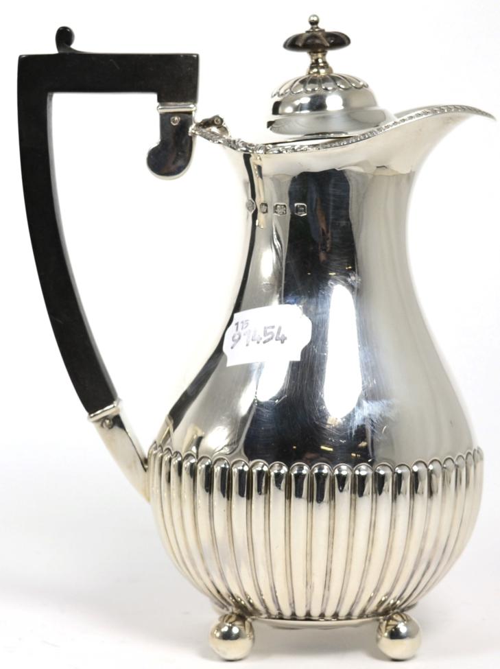 Lot 63 - A silver hot water pot, William Hutton & Sons, Sheffield 1925, part fluted baluster form on...