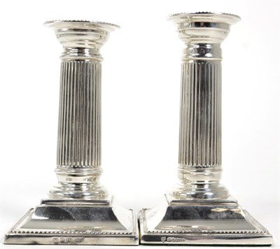 Lot 68 - A near pair of silver column candlesticks, one C J Vander, Sheffield 2000, the other marked...