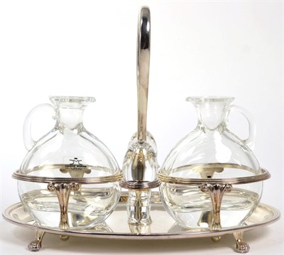 Lot 69 - A modern silver oil and vinegar cruet, Birmingham 1996, oval with reeded borders, with two...