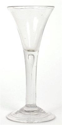 Lot 73 - An 18th century wine glass with trumpet shaped bowl, tear drop stem, and folded foot, 15.5cm high