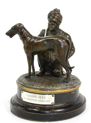 Lot 77 - A bronze figure group of Great Dane with attendant Indian handler, the reverse base stamped...