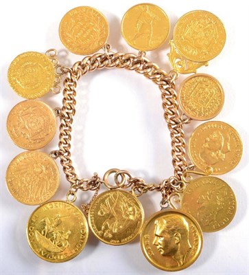 Lot 96 - A curb link charm bracelet, suspending ten various world coins (most replicas), a Yuri Gagarin...