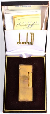 Lot 98 - A Dunhill Rollagas Barley pattern engine turned gold plated lighter in original box with paperwork