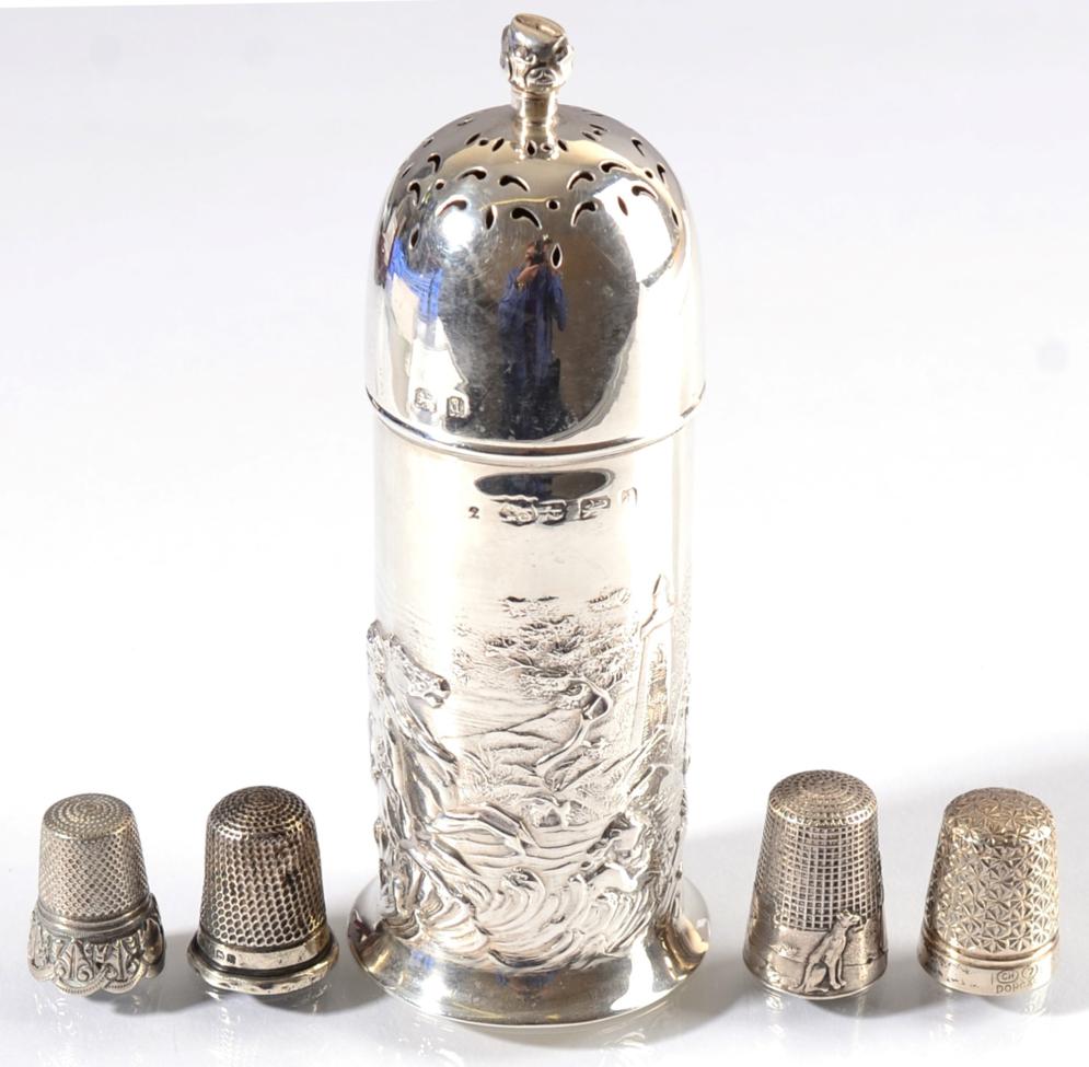 Lot 100 - A silver castor and four thimbles