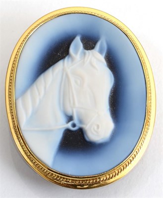 Lot 131 - An 18 carat gold sardonyx equestrian cameo brooch/pendant, in a rope frame, measures 4cm by 3cm