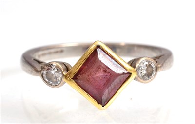 Lot 134 - An 18 carat white and yellow gold pink tourmaline and diamond three stone ring, a square cut...