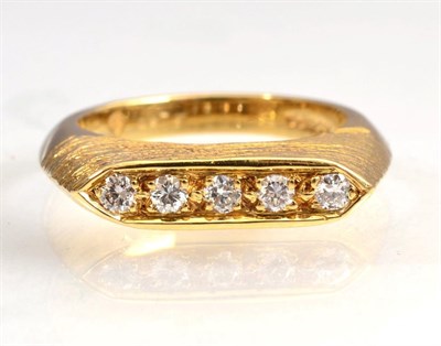 Lot 136 - An 18 carat gold diamond ring, five round brilliant cut diamonds inset to a tapering textured...