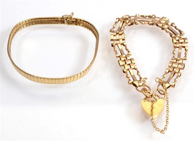 Lot 140 - A 9 carat gold fancy gate link bracelet with a 9 carat gold padlock clasp, length 18cm and a 9...