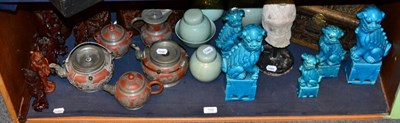 Lot 169 - A group of decorative Oriental wares including four carved bamboo sleeve vases, a carved wooden...