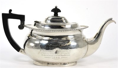 Lot 194 - A late Victorian silver teapot, Nathan & Hayes, Chester 1897, with military presentation...