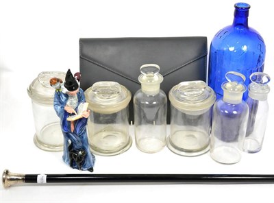 Lot 232 - A silver mounted ebonised walking cane; a Royal Doulton model The Wizard; a group of six glass jars