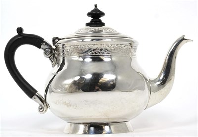 Lot 234 - A silver teapot, Wakely & Wheeler, London 1922, circular baluster form with engraved borders,...
