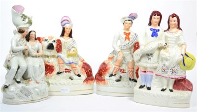 Lot 242 - A pair of large Staffordshire figure groups of a boy and girl sitting on spaniels; two other...