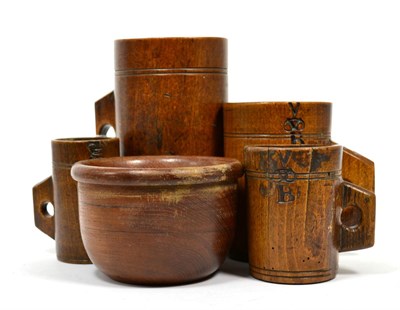 Lot 243 - Four Victorian measuring wooden tankards and a small mixing bowl