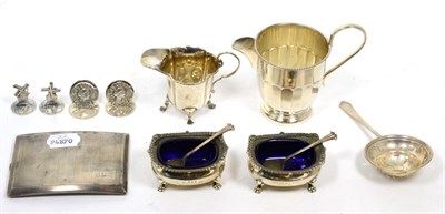 Lot 261 - A quantity of silver consisting of a cigarette case, strainer, two salts with blue glass...