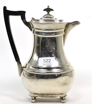 Lot 322 - A silver hot water jug, William Hutton, Sheffield 1936, rounded rectangular on ball support,...