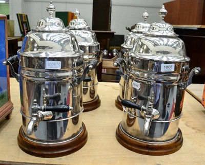 Lot 1008 - Four electroplated Walker & Hall tea urns