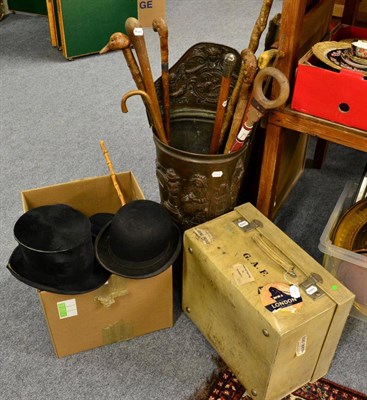 Lot 1016 - Bowler hats, silk top hat (a.f.), navy riding hat, boot pulls, white vellum suitcase, leather...