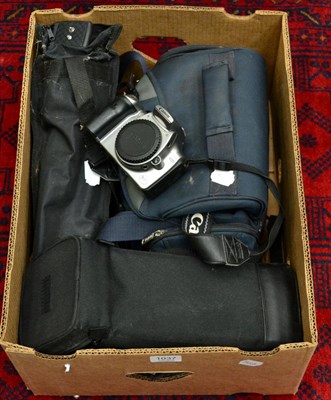 Lot 1037 - A digital Canon camera with a Canon lens, Sigma lens and a small camera tripod