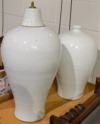 Lot 1073 - A Chinese white glazed vase and lamp (2)