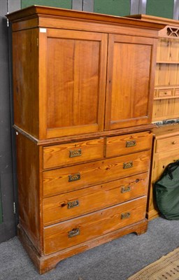 Lot 1101 - A pitch pine linen press