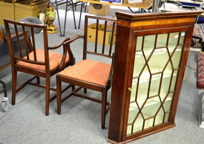 Lot 1103 - A Georgian glazed mahogany corner cupboard and a pair of 19th century mahogany armchairs (3)