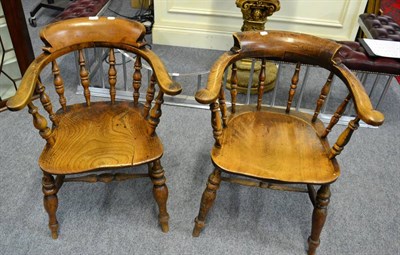 Lot 1122 - Two oak and elm captains chairs