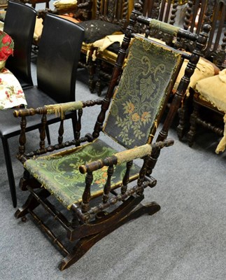 Lot 1124 - An American style rocking chair