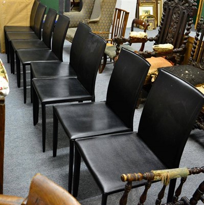 Lot 1125 - A set of eight black leather dining chairs retailed by Actona, Denmark, in the Andrew design