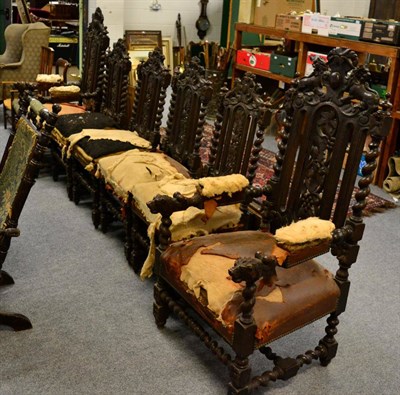 Lot 1131 - A set of six ornately carved oak chairs including two carvers