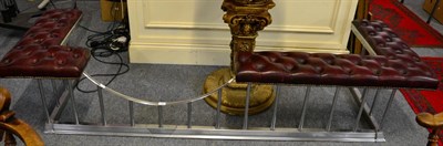 Lot 1133 - A leather upholstered club fender