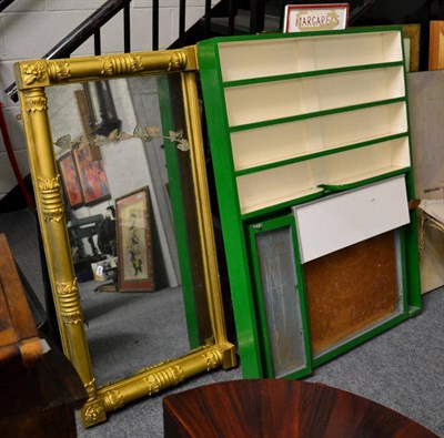 Lot 1135 - A green a cream painted shop display shelf and a gilt frame over mantel mirror