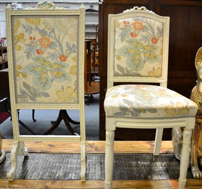 Lot 1147 - A white painted chair together with a similar fire screen each with matching upholstery