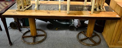 Lot 1149 - A large contemporary wooden and metal table composed of salvage elements