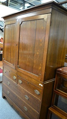 Lot 1157 - A Georgian and later oak linen press