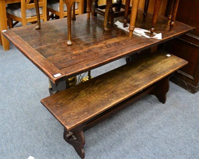 Lot 1167 - A small oak refectory table and a matching bench