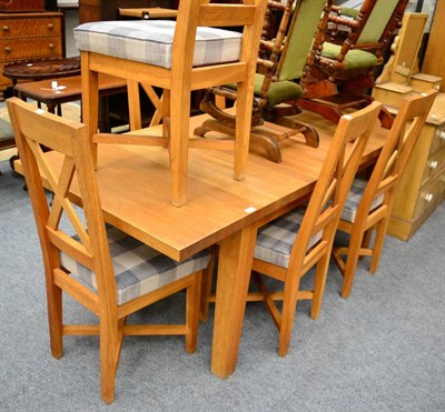 Lot 1172 - An oak dining table and six chairs