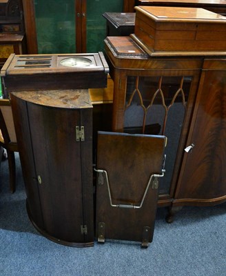 Lot 1179 - A Georgian oak bow fronted hanging corner cupboard; a trouser press; a canteen box; and a clock (4)