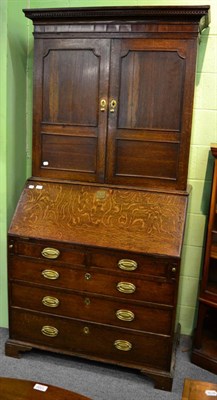 Lot 1286 - A 19th century oak and mahogany bureau bookcase