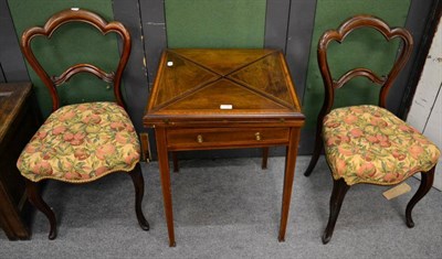 Lot 1288 - A rosewood envelope table and a pair of chairs (3)