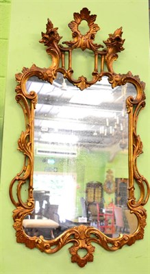 Lot 1291 - An 18th century style scroll decorated gilt wood framed wall mirror