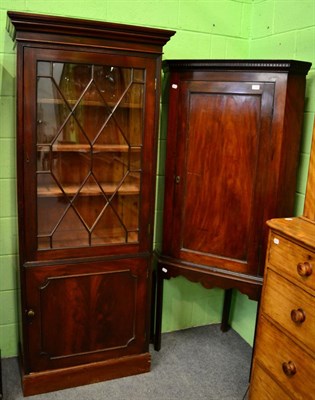 Lot 1295 - A mahogany corner cupboard on stand and a Georgian mahogany bureau