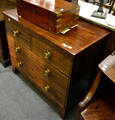 Lot 1333 - An early 19th century mahogany three height chest of drawers