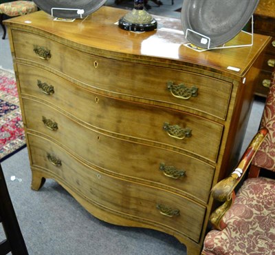 Lot 1342 - George III serpentine front four height chest of drawers