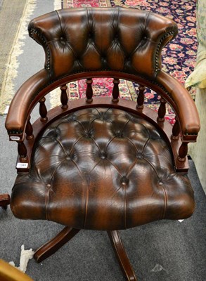 Lot 1344 - A brown leather desk chair