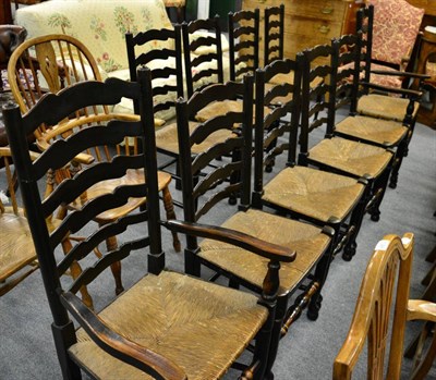 Lot 1347 - A set of ten Lancashire type rush seated ladder back dining chairs including a pair of carvers