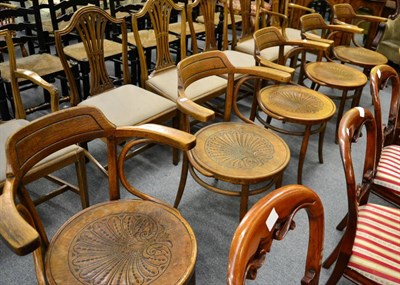 Lot 1349 - Set of five 1930's oak dining chairs, the seats carved with a shell decoration, paper labels to the